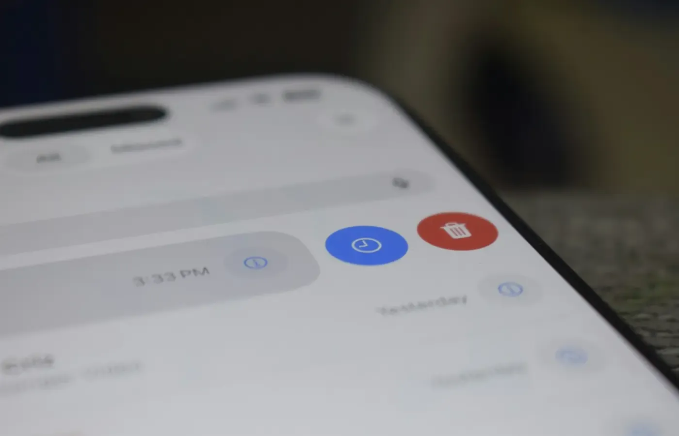 A smartphone screen displaying a list of notifications with blue and red icons